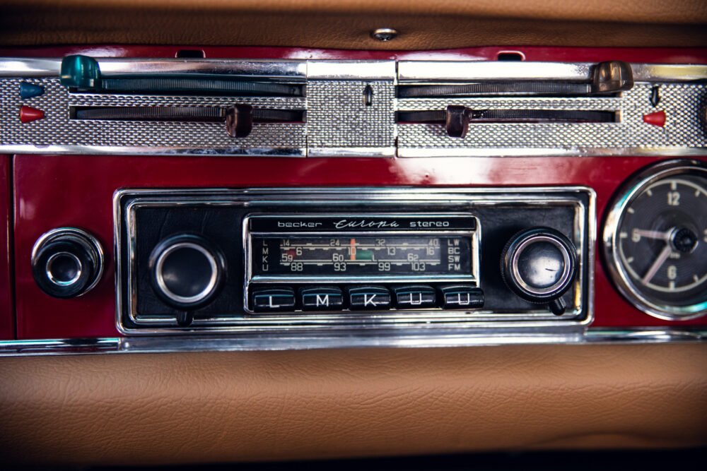 Vintage car radio and dashboard close-up.