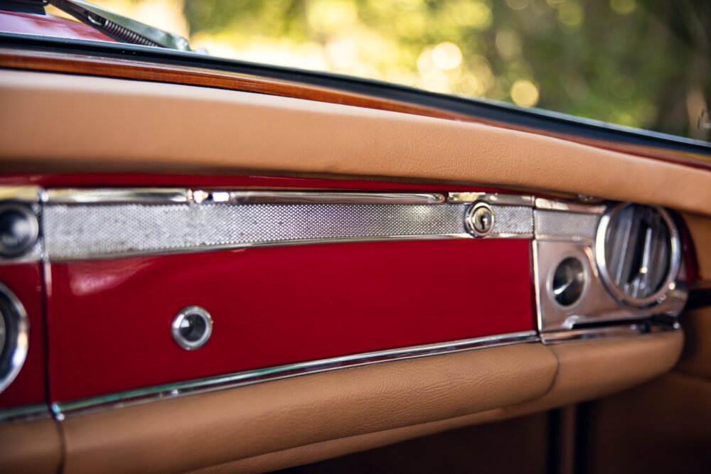 Vintage car's red and tan interior detail.