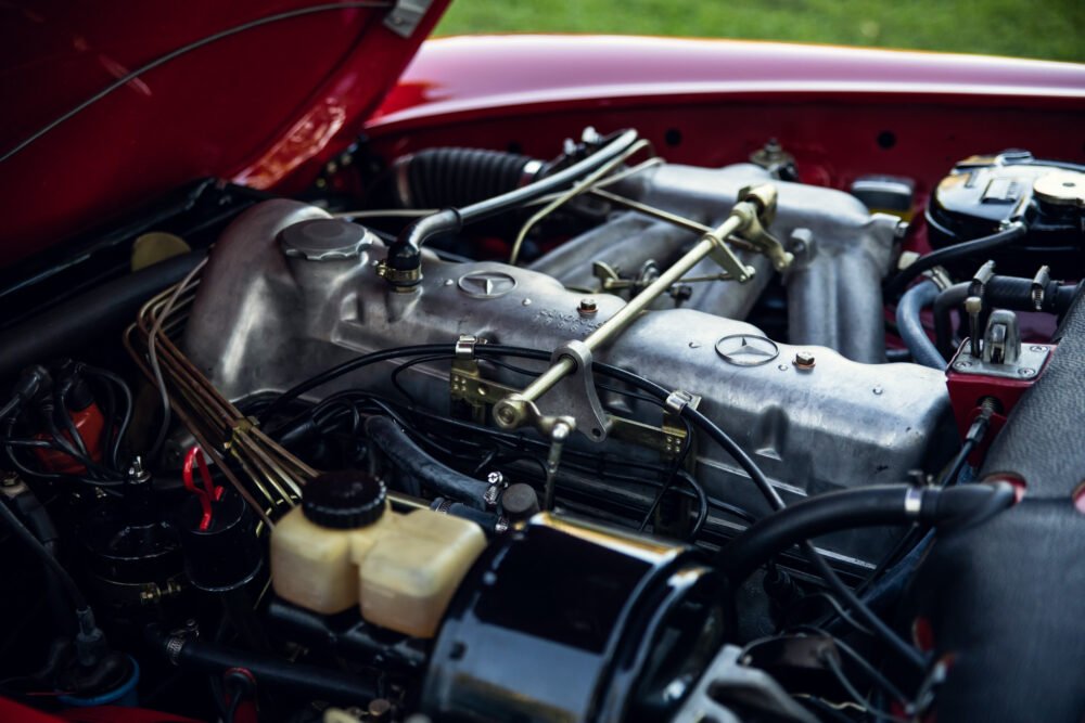 Vintage red car engine close-up.