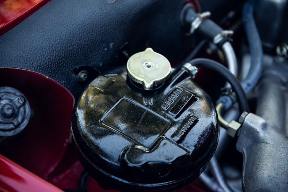 Close-up of vintage car brake fluid reservoir.
