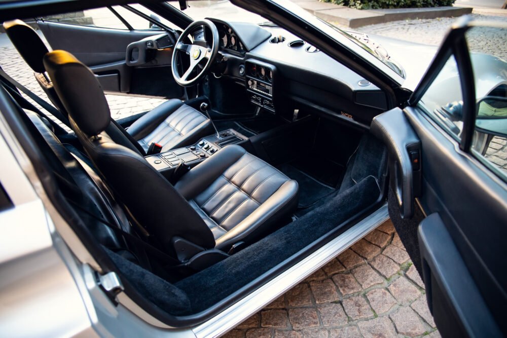 Interior view of classic luxury car with leather seats.