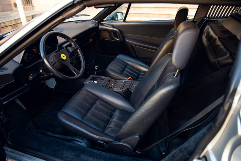 Interior of luxury sports car with leather seats.