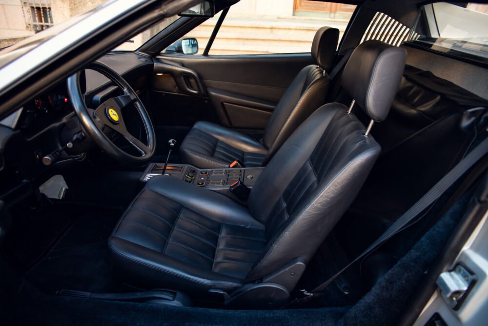 Interior of a luxury black leather car.
