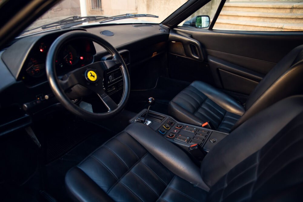 Ferrari interior with steering wheel and leather seats