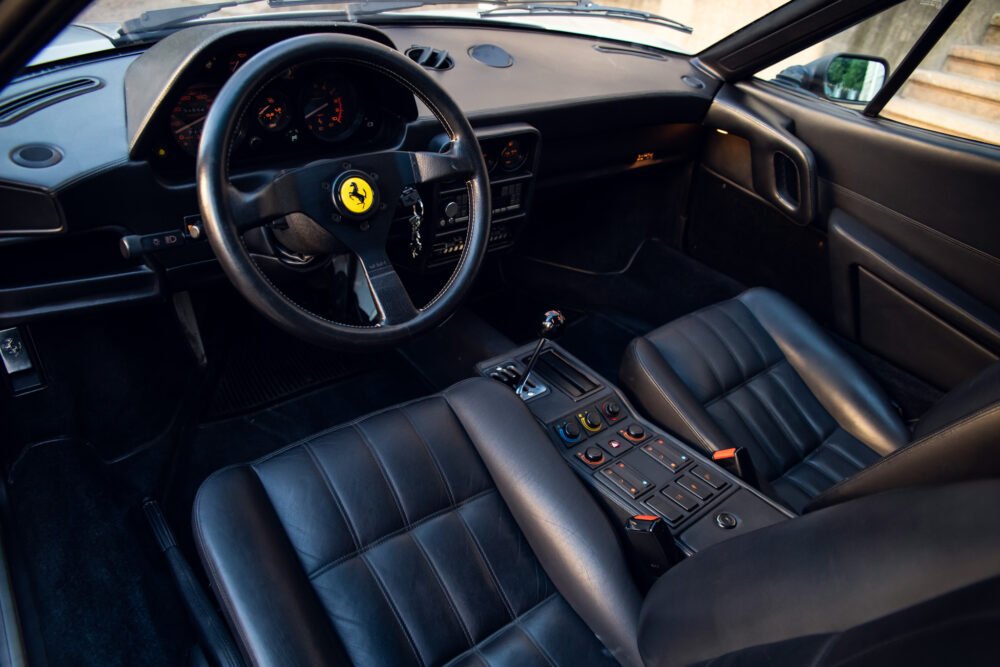 Interior of luxury sports car with leather seats.