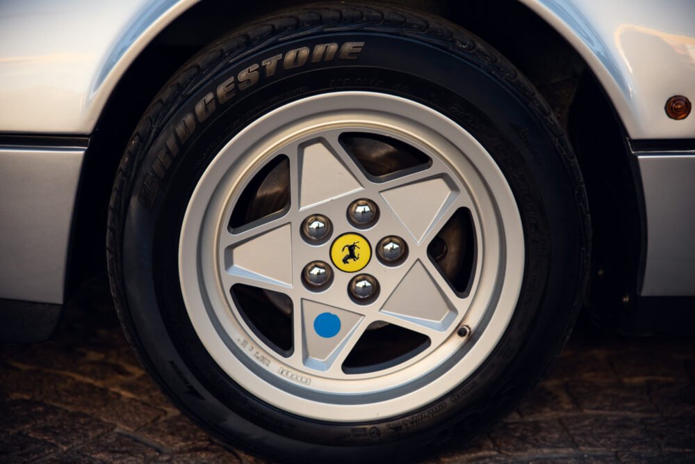 Ferrari wheel with Bridgestone tire close-up.
