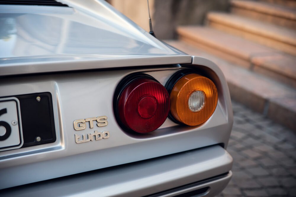 Close-up of GTS Turbo car's rear lights.