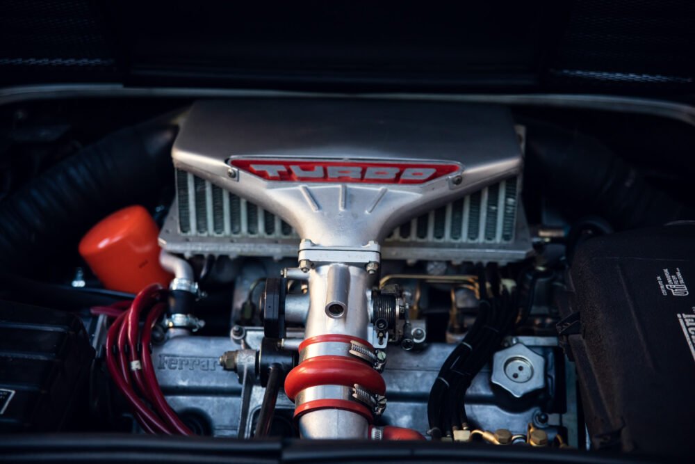 Detailed view of a turbocharged Ferrari engine.