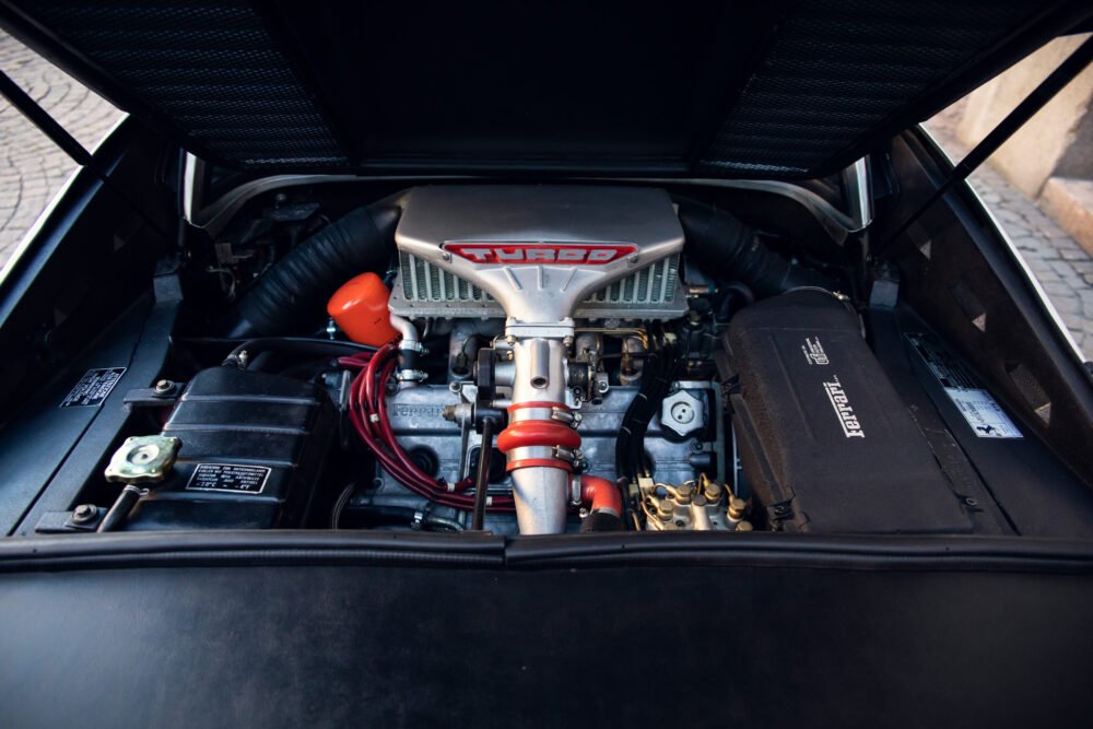 Detailed view of car's turbocharged engine compartment.