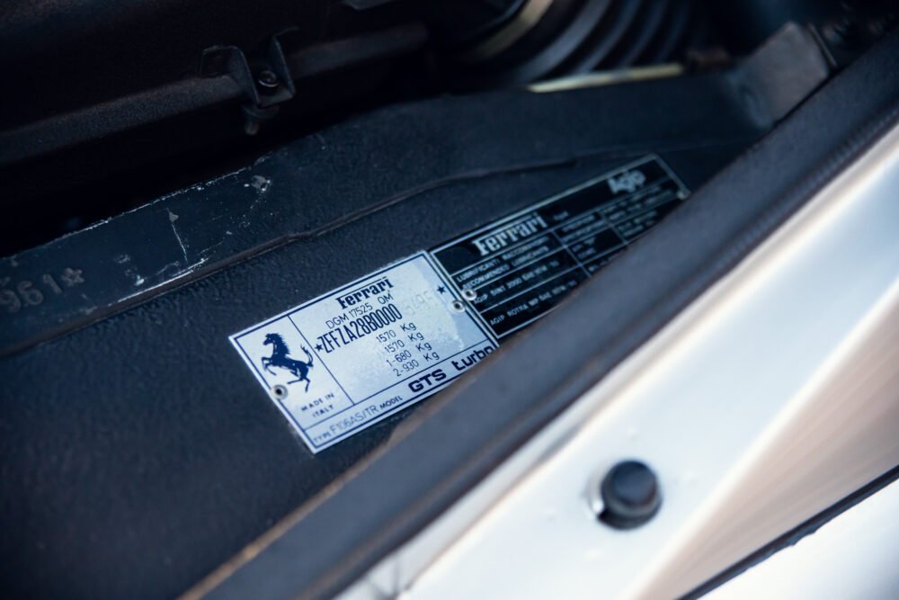 Close-up of Ferrari vehicle identification sticker.