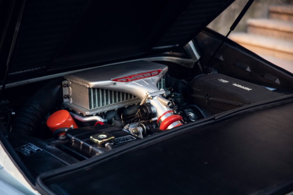 Close-up of turbo engine in car hood.