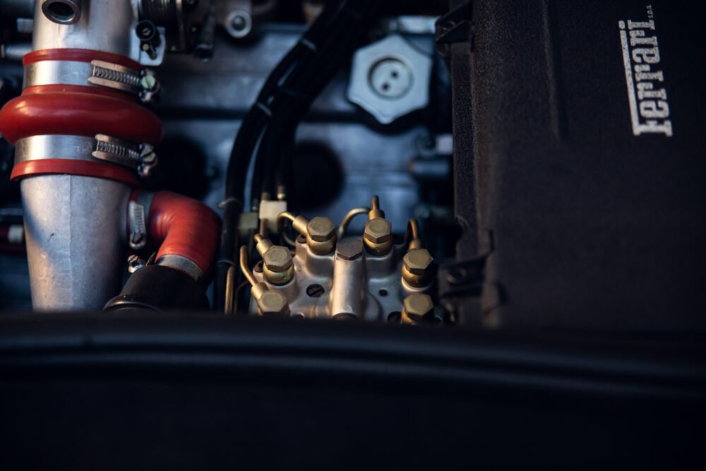 Close-up of intricate Ferrari engine components.