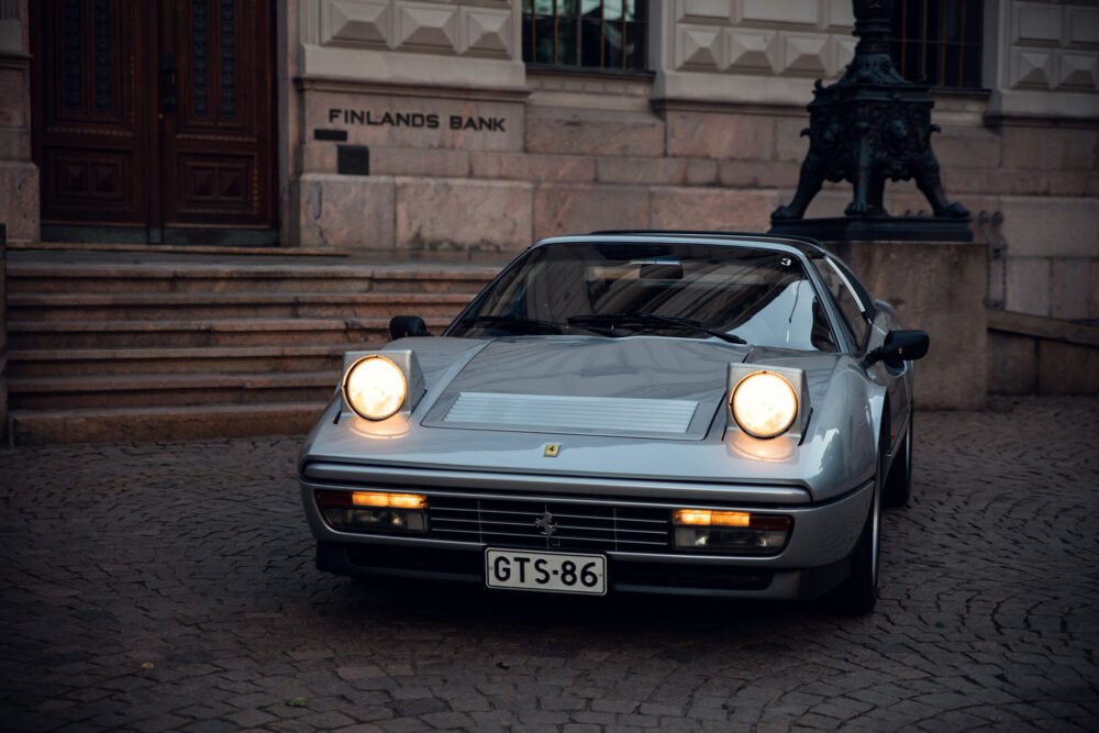 Silver Ferrari in front of Finlands Bank at dusk.
