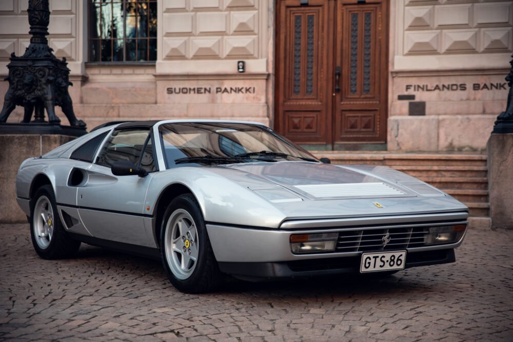 Silver Ferrari 328 GTS in front of Finland's Bank.