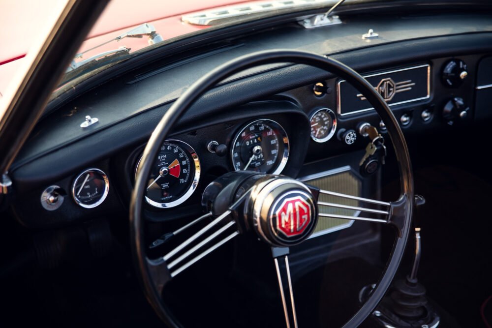 Vintage MG car dashboard and steering wheel.