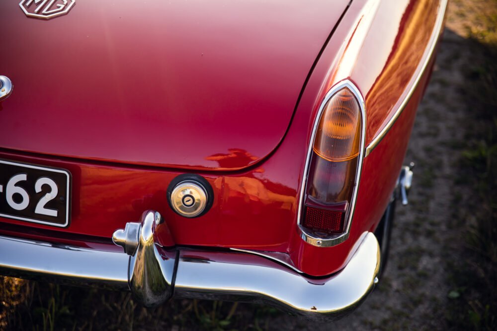 Close-up of vintage red MG car's rear end.