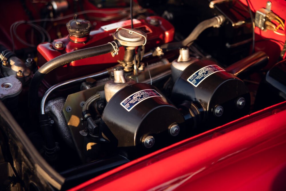 Close-up of a red car engine bay.