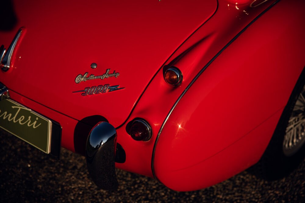 Close-up of red Alfa Romeo 3000Z tail lights.