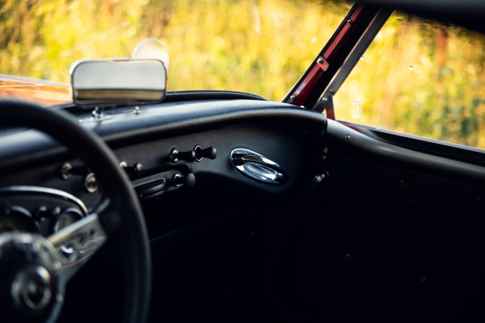 Vintage car interior with blurred nature background.