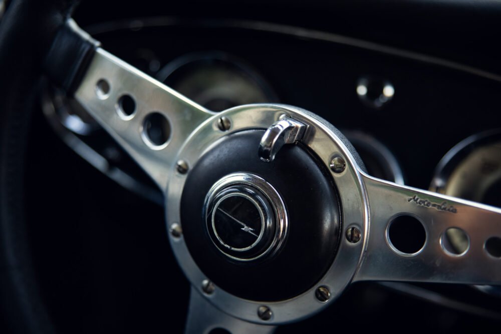 Vintage car steering wheel close-up.