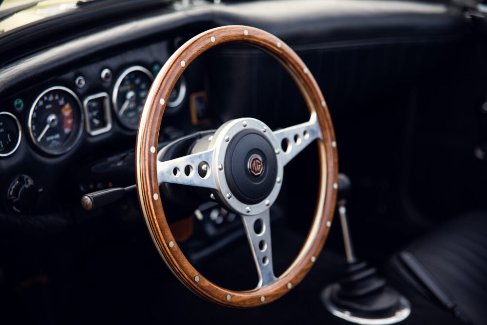 Vintage MG car wooden steering wheel and dashboard.