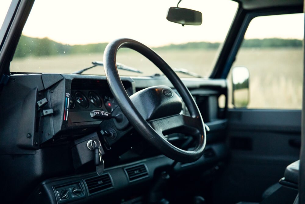 Interior view of vehicle dashboard at dusk.