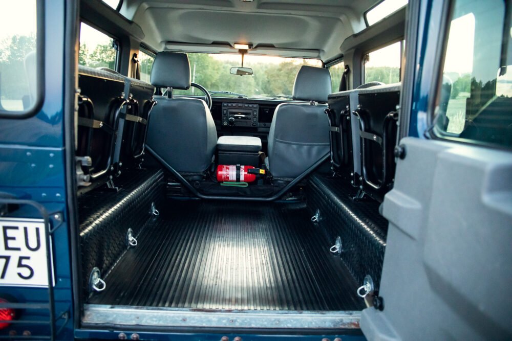 Interior view of an empty van with rear seats folded.