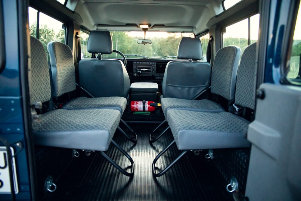 Interior view of a spacious van with multiple seats.