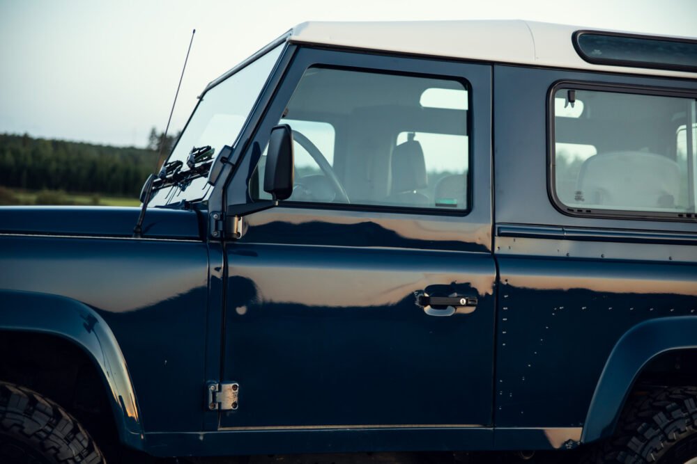 Close-up view of a navy blue off-road vehicle.