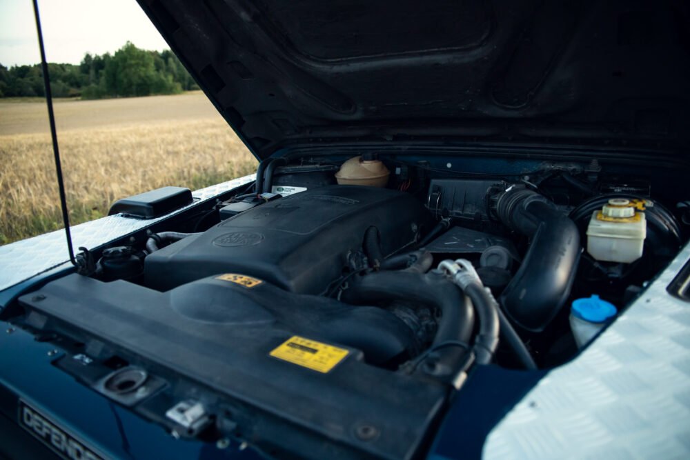 Open car hood showing detailed engine compartment.