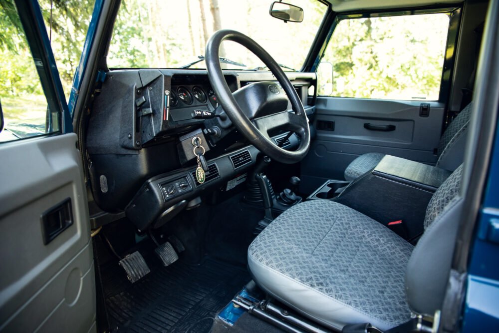 Interior view of vintage SUV driver's side.