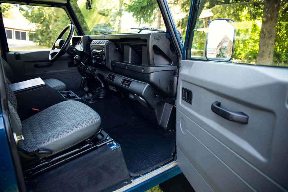 Interior view of an older model vehicle's driver's side.