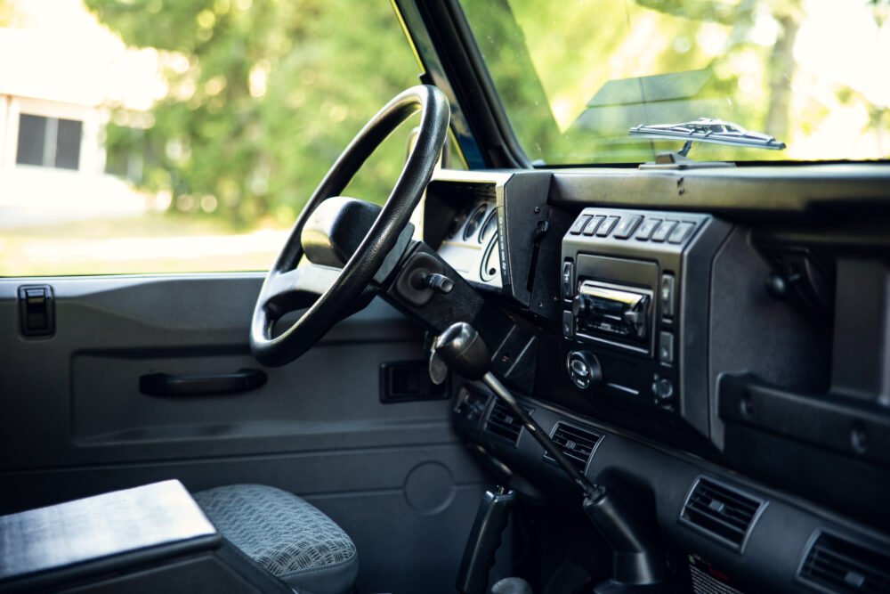 Vintage car interior, steering wheel and dashboard.