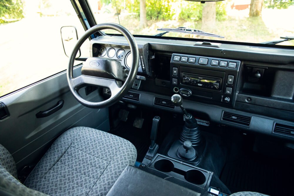 Interior of vintage Land Rover with manual transmission.