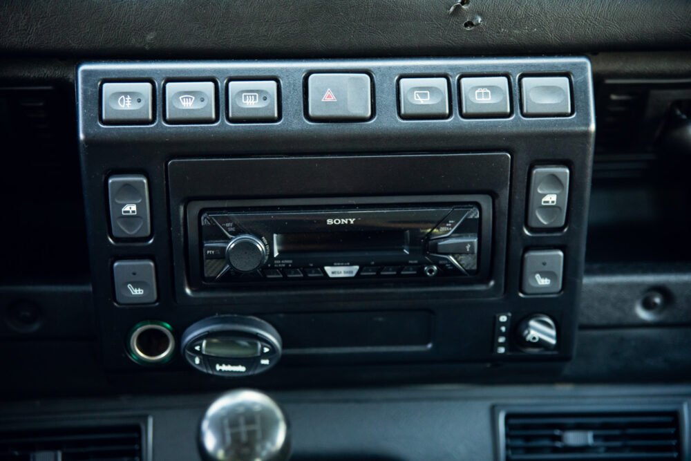 Car dashboard featuring Sony stereo system and control buttons.