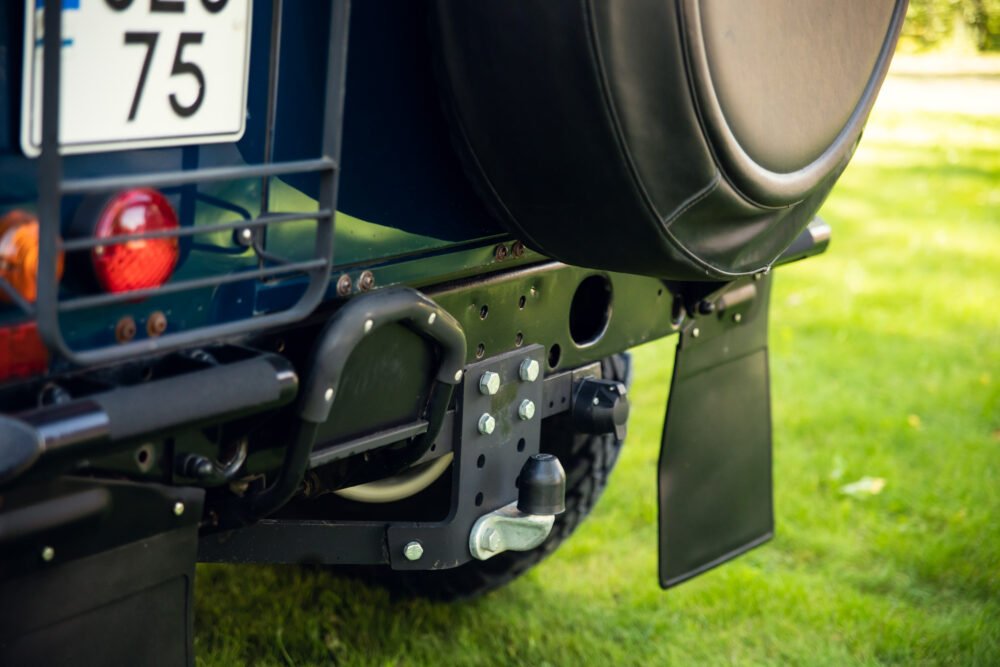 Close-up of motorcycle license plate and rear light.