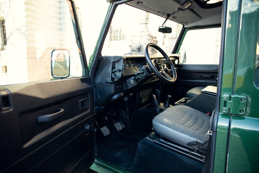 Interior view of vintage green truck cab.