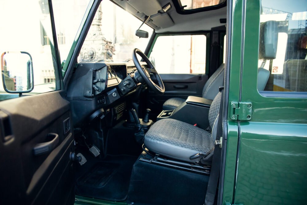 Interior view of a vintage green SUV.