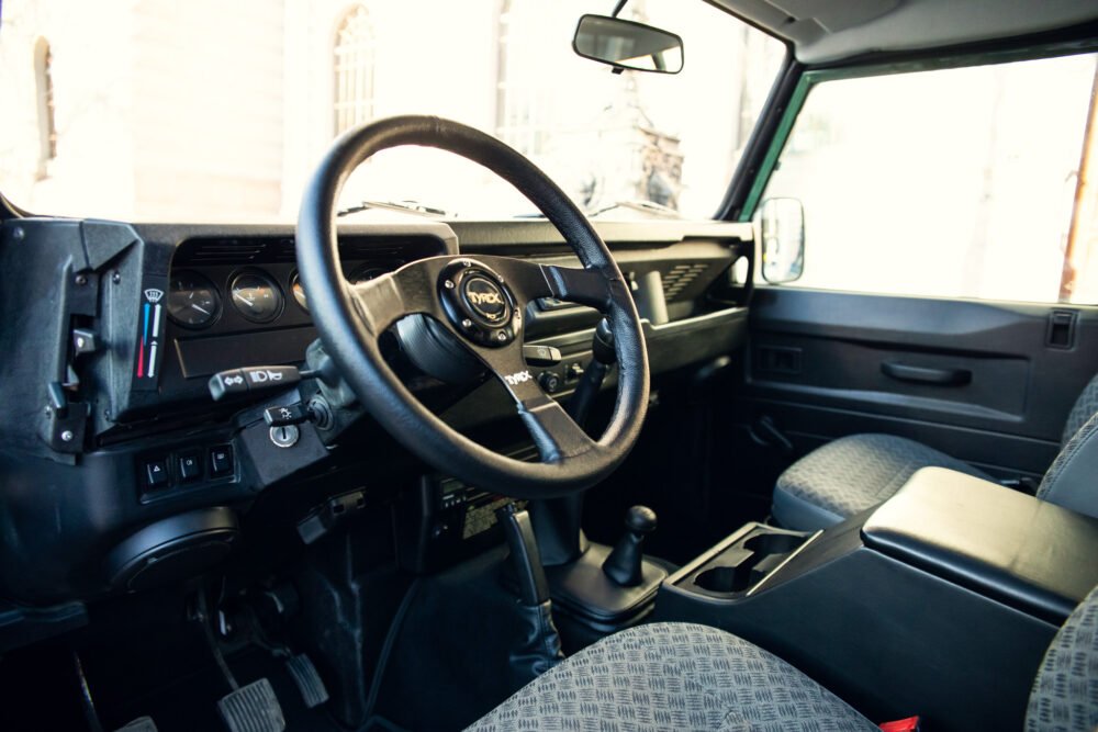 Interior of vintage SUV with manual transmission.