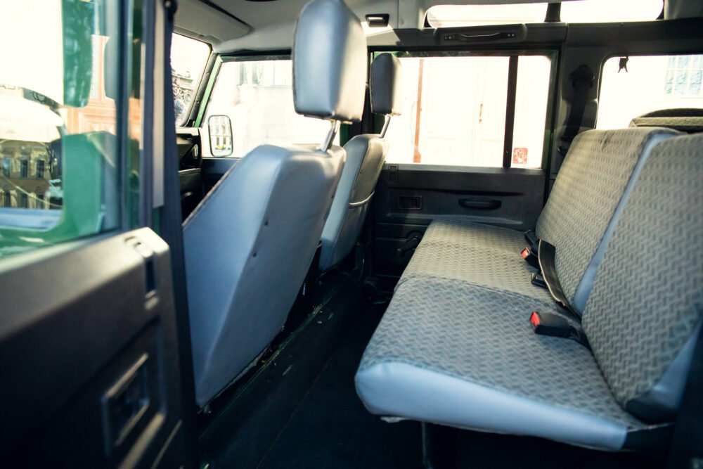 Interior view of an empty van with open door.