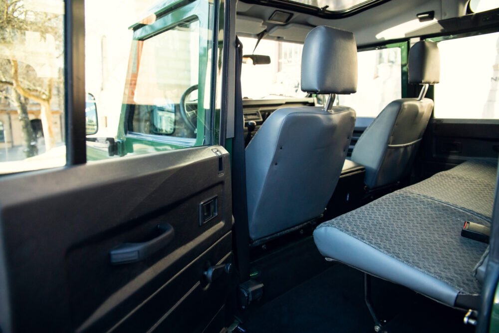 Interior view of an empty vehicle with multiple seats.