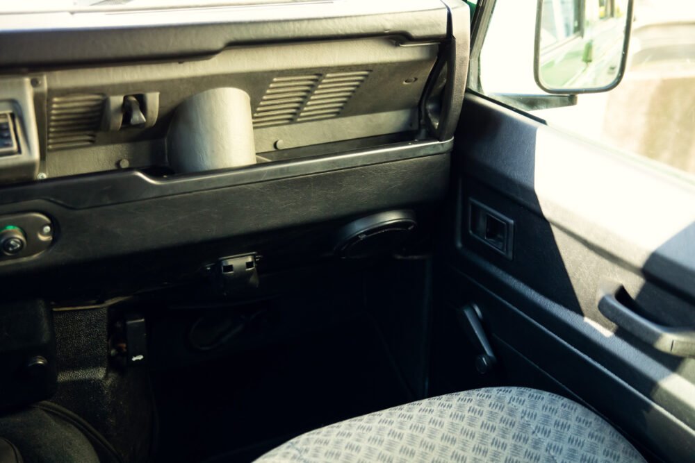 Interior view of old car with fabric seats.