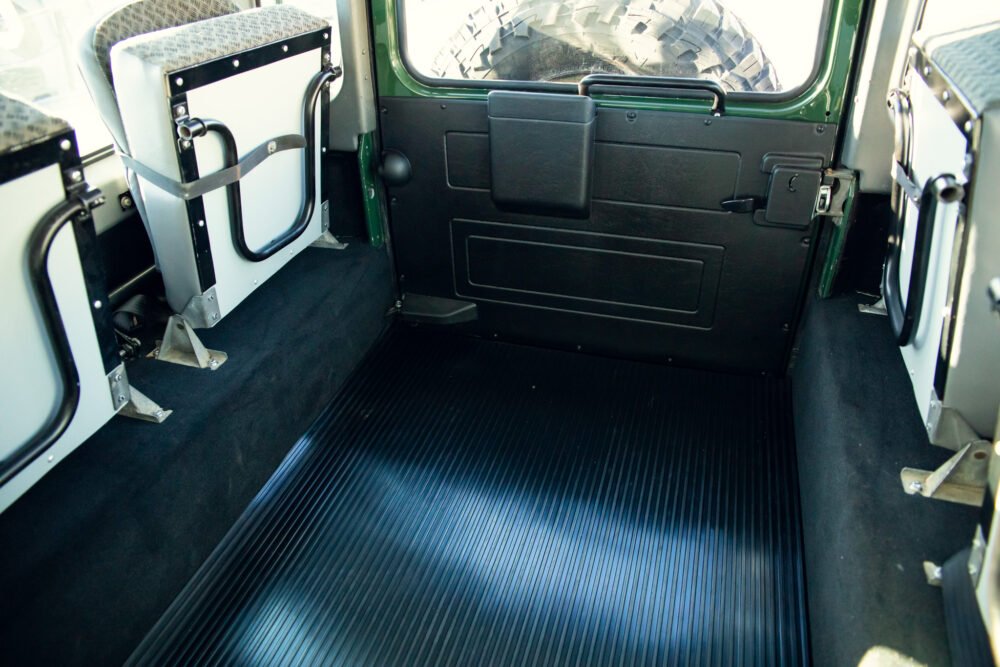 Interior of an empty green vehicle cabin.