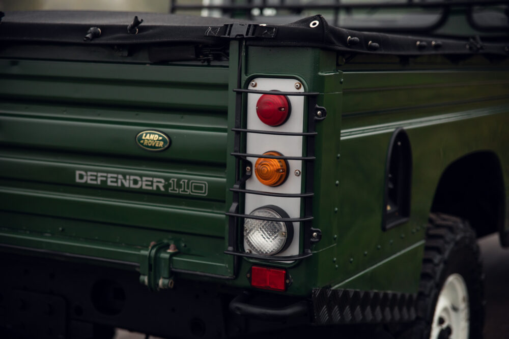 Green Land Rover Defender 110 tail light detail.