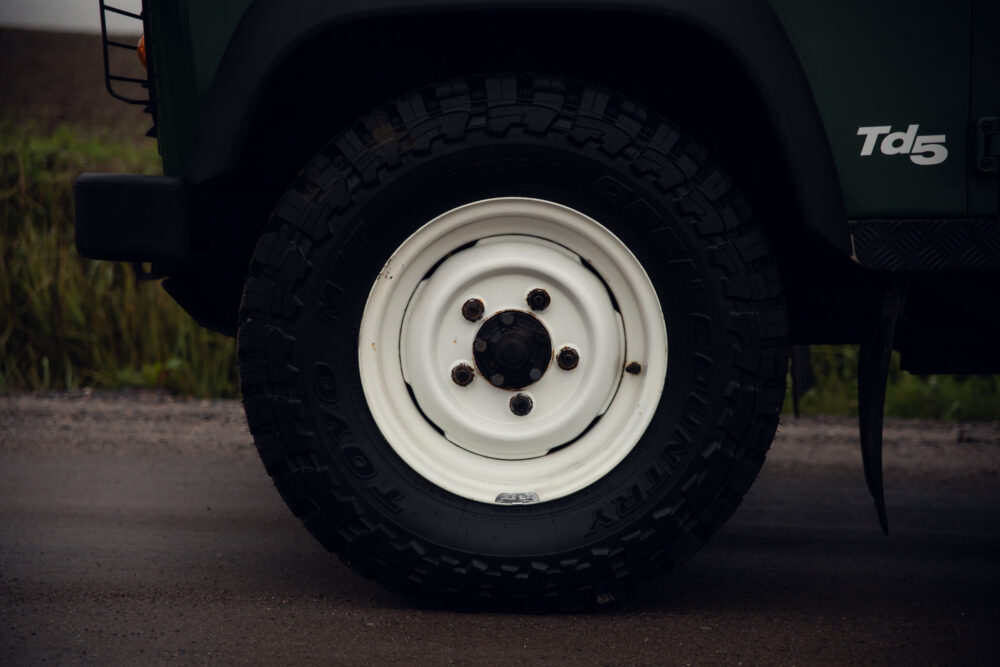 Close-up of off-road vehicle tire and wheel.