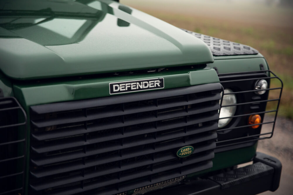 Close-up of green Land Rover Defender grille.