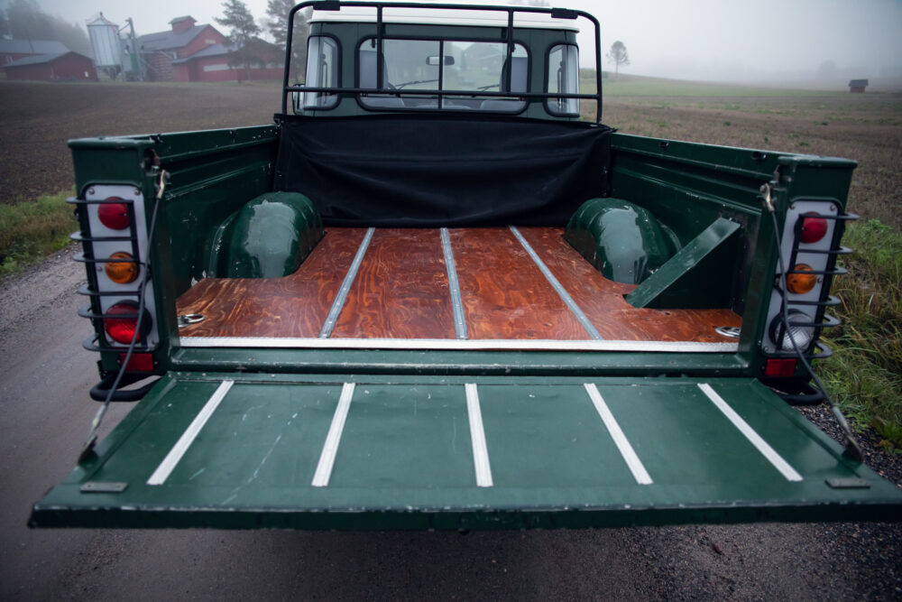 Open truck bed in misty rural setting.