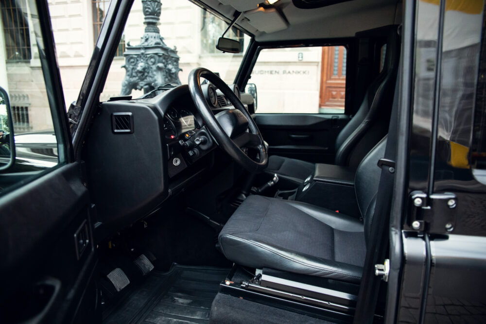 Interior view of modern vehicle dashboard and steering wheel.