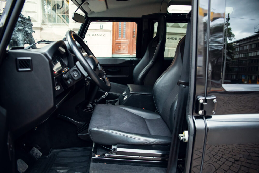 Interior view of an open-door modern SUV.