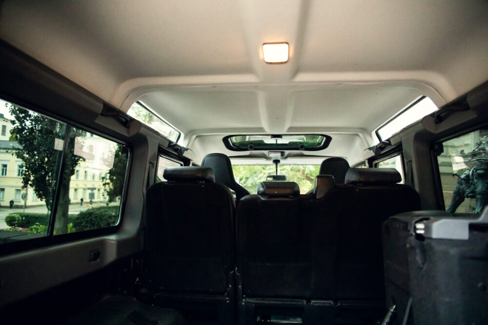 Interior view of an empty van with urban background.